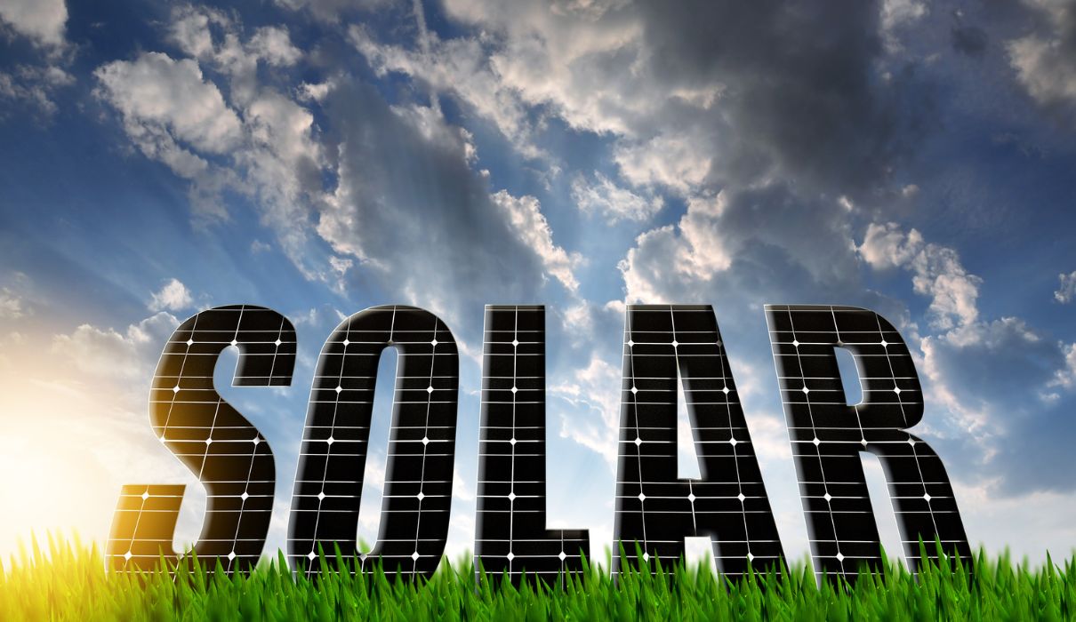 SOLAR text made of panels against sky